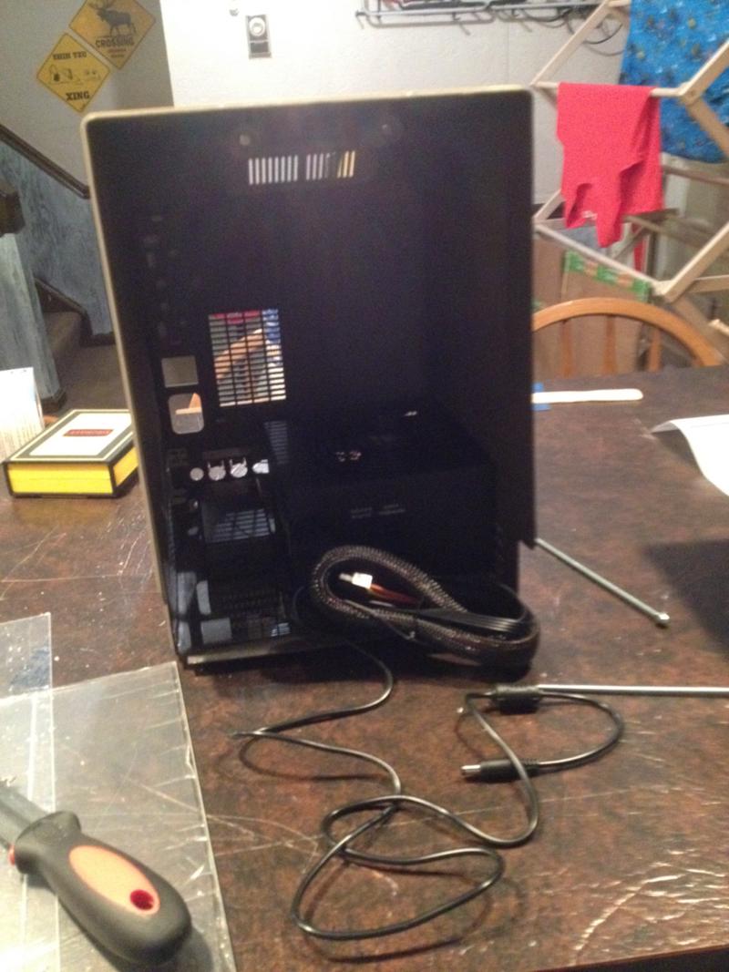 The Mac shell with a PC power supply sitting on the frame.