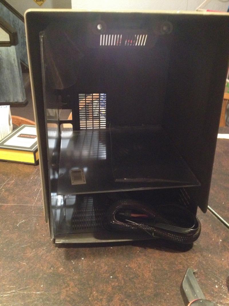 The Mac case with PC components stacked internally.