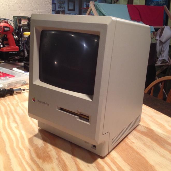 An old Mac Plus on a counter.