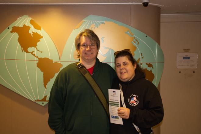 My wife and I standing in front of a period world map adorning one wall of the lobby.